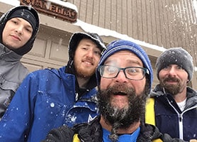 Mills Roofing team working in the snow