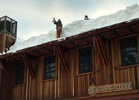 Mills Roofing team working in the snow