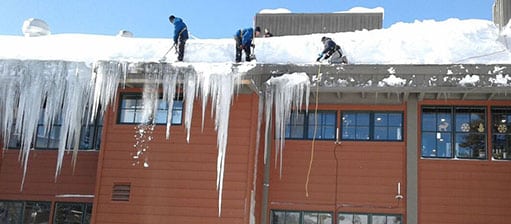 Mills Roofing team working in the snow